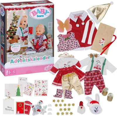 A Baby Born advent calendar with various accessories laid out around it.