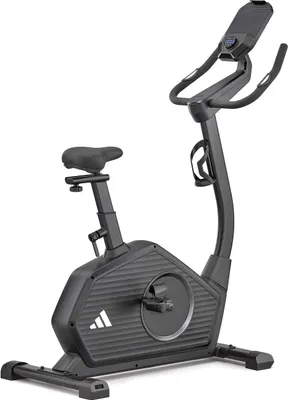 A black Adidas exercise bike is shown against a white background.