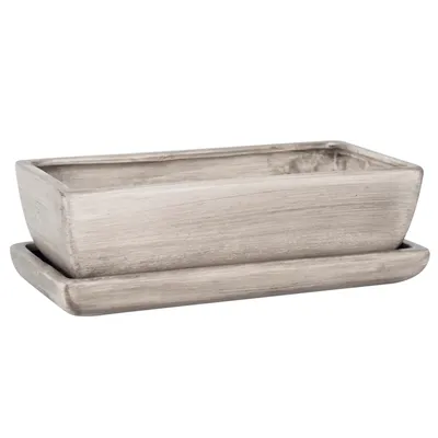 A rectangular planter with a matching saucer, both in a distressed gray concrete-like finish, is presented against a white background.