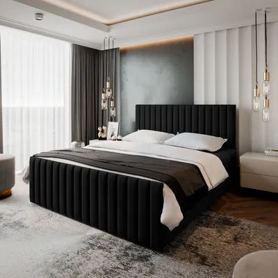 A modern bedroom with a black upholstered bed as the focal point.
