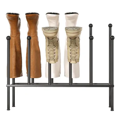 A boot rack holding four pairs of boots.