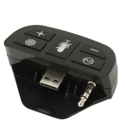 A black stereo headset adapter with several buttons and connectors.