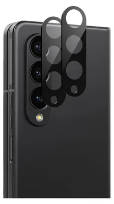 A close-up of the rear camera module of a black smartphone, with two protective glass covers placed over it.