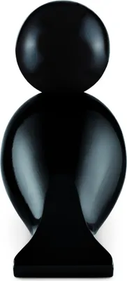 A black, abstract sculpture resembling a stylized human figure, presented against a white background.