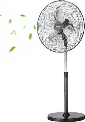 A black and silver industrial stand fan is shown against a white background, with green leaf graphics indicating airflow.