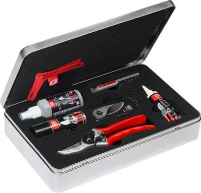 A metal box containing gardening tools and maintenance supplies.