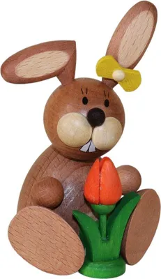 Produktbild von Osterfigur Hase sitzend mit einer Tulpe bunt BxHxT 7x11x7cm NEU