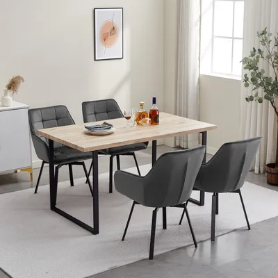 A dining set with a wooden table and four gray chairs in a room.