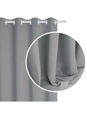 A close-up view of a gray curtain with grommets, hanging from a curtain rod.