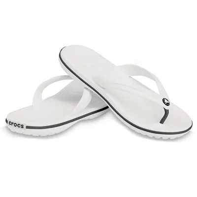 A pair of white Crocs flip-flops on a white background.