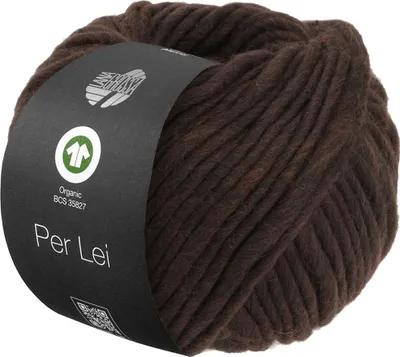 A ball of dark brown yarn with a black label wrapped around it.