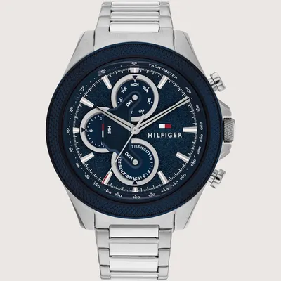 A close-up studio shot of a Tommy Hilfiger analog watch.