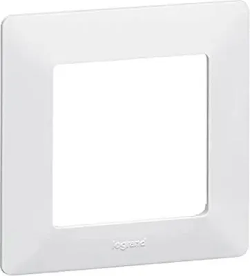 A white frame for an electrical outlet or switch.
