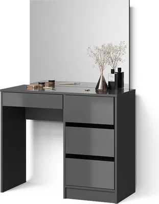 A modern grey dressing table with a large mirror and drawers, decorated with a vase of dried flowers and perfume bottles.