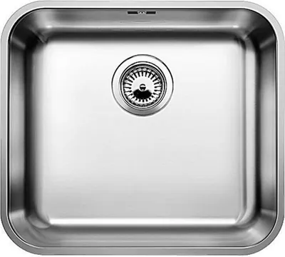 A stainless steel kitchen sink with a drain.