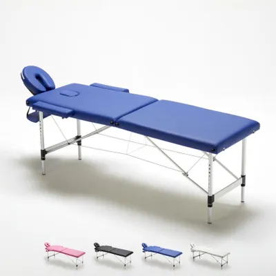 A blue massage table is shown in the center of the image, with smaller versions of the same table in pink, black, and white shown in the foreground.