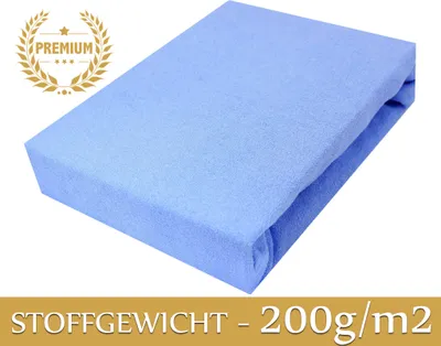 A folded blue fitted sheet on a white background with a 'PREMIUM' badge and text indicating fabric weight.