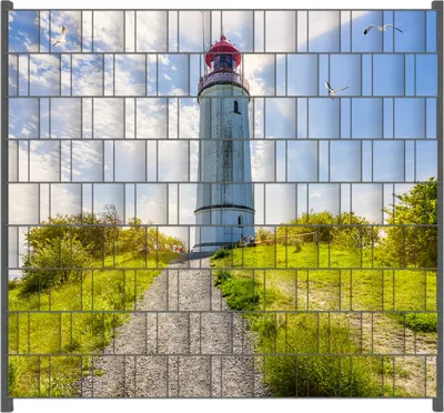 Produktbild von Wallario Zaunsichtschutz mit Motiv Leuchtturm auf Hiddensee bei Sonnenschein für Ein- und Doppelstabmatten Zäune in der Größe 200 x 180 cm