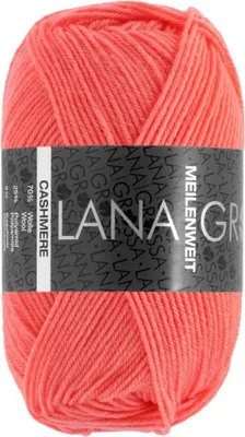 A ball of coral-colored yarn with a black label.