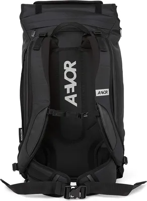 The back of a black travel backpack.