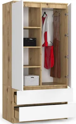 An open wardrobe with clothes hanging inside and drawers at the bottom.