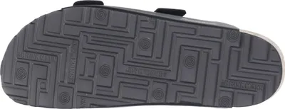 The sole of a black sandal is shown.