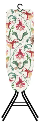 An ironing board cover with a floral and bird pattern, shown hanging from a hook and supported by its legs.