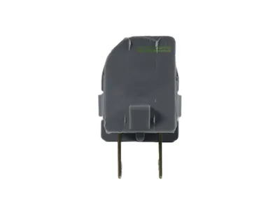 A close-up product shot of a gray safety switch with two silver pins, isolated on a white background.