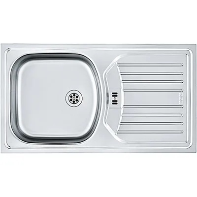 A top-down view of a stainless steel kitchen sink with a drainer.