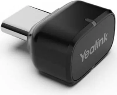 A close-up studio shot of a black Yealink Bluetooth adapter with a silver USB-C connector.