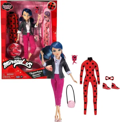 A doll and its accessories are displayed against a white background, with the product packaging visible on the left.