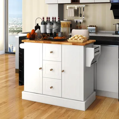 A white kitchen island with a wooden countertop is shown in a kitchen setting.