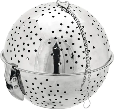 A silver metal tea infuser ball with a chain and clasp.
