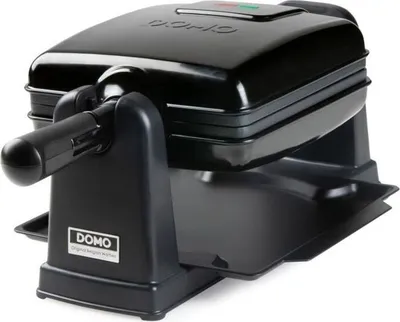 A black waffle maker.