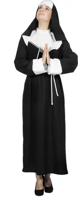 A woman dressed as a nun, praying.