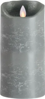 A close-up of a gray LED candle with a flickering flame.