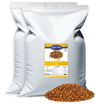 Two large white bags of birdseed with a label and a pile of birdseed in front.