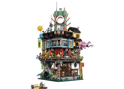 A detailed LEGO model of a multi-story building with a Japanese architectural style, set against a white background.