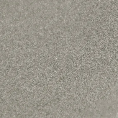 Close-up, textured surface of a gray fabric.