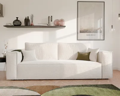 A modern living room scene featuring a beige boucle sofa, a shelf with decorative items, and a framed poster on the wall.