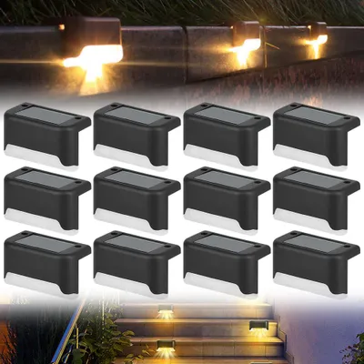 Solar-powered outdoor lights illuminating steps and a walkway at night.