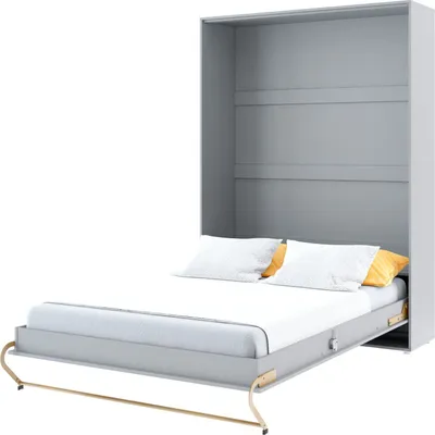A gray wall bed unit with a bed pulled out, showing white and orange pillows on the mattress. The unit has shelves visible at the top.