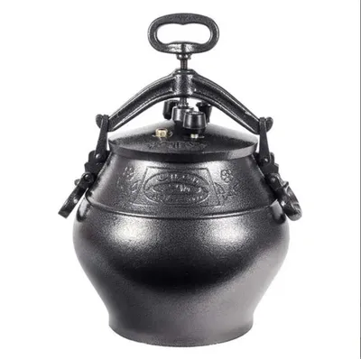 A black cast iron pressure cooker with a handle on top, set against a white background.