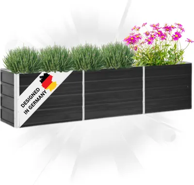 A black planter box filled with green plants and pink flowers, with a "Designed in Germany" label.