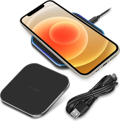 A smartphone is shown charging wirelessly on a charging pad, with a USB cable next to it.