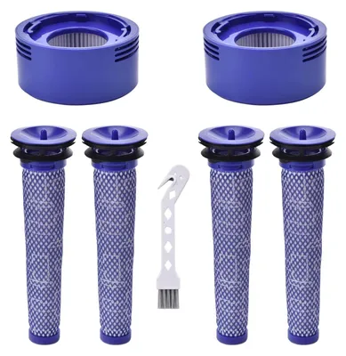 A collection of vacuum cleaner replacement filters and a cleaning brush.