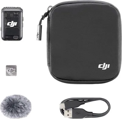 A collection of DJI Mic 2 transmitter components, including the transmitter, a carrying case, a windscreen, and a USB cable, arranged on a white background.