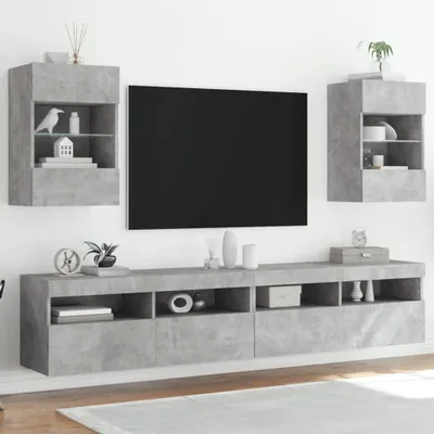 A modern living room setup with a TV and wall-mounted cabinets.