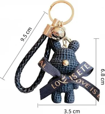Productafbeelding van Sleutelhanger met een zwarte beer, goudkleurig, gemaakt van synthetisch materiaal en een legering van basismetalen, afmetingen 6,8 x 3,5 cm