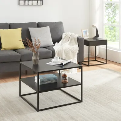 A living room scene with a couch, coffee table, and side table.